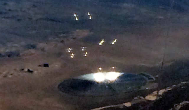 Flying Saucer seen near Area 51 photographed from a plane window.