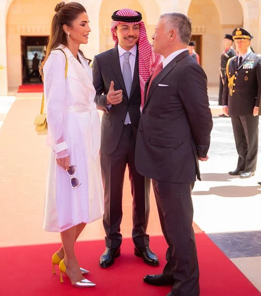 Queen Rania wore a long trench coat by Lanvin. Queen Rania wore Lanvin lacquered twill and organza long trench coat