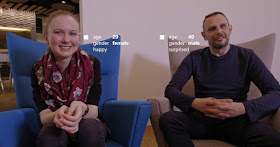 two people sitting and looking foward