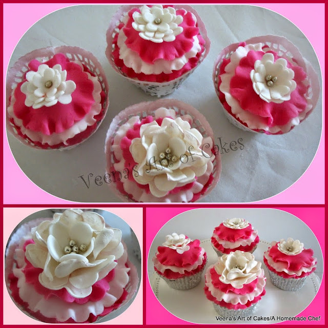 Cupcakes decorated with sugar flowers.