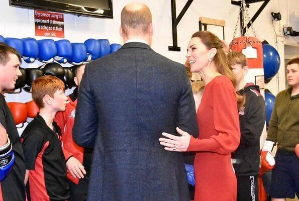 Kate Middleton wore a new navy coat by Hobbs London, and a new knitted puff-sleeve midi dress by Zara. Beulah London Kamala scarf