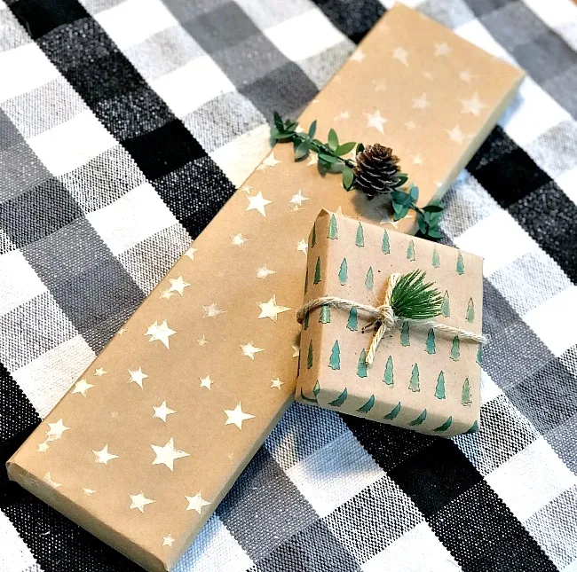 wrapped gifts with stars and trees
