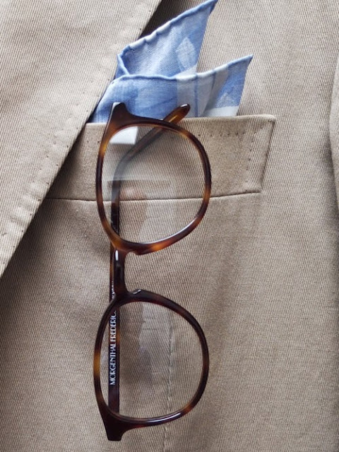 stylish pocket square and eye glasses
