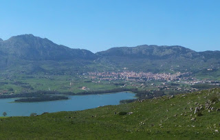 The lake of Piana degli Albanesi with the town in the distance
