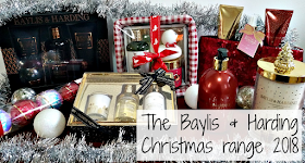 a selection of the baylis and harding xmas range surrounded by baubles and tinsel 