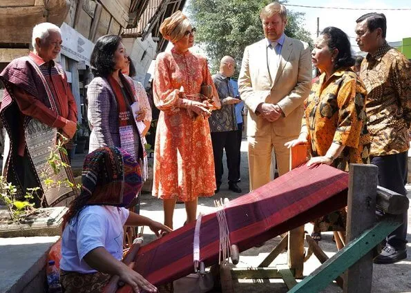 Queen Maxima wore Zimmermann Veneto border paisley print linen dress. Maxima visited a traditional Batak village and Del Institute