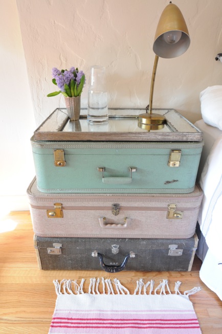 These stacked vintage suitcases work great as a nightstand. 