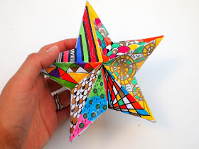 Doodle some designs on these awesome 3D paper Christmas Stars- great Kids art project