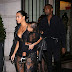Kim Kardashian gets racy in plunging black lace jumpsuit at Givenchy show for Paris Fashion Week alongside Kanye West and baby North