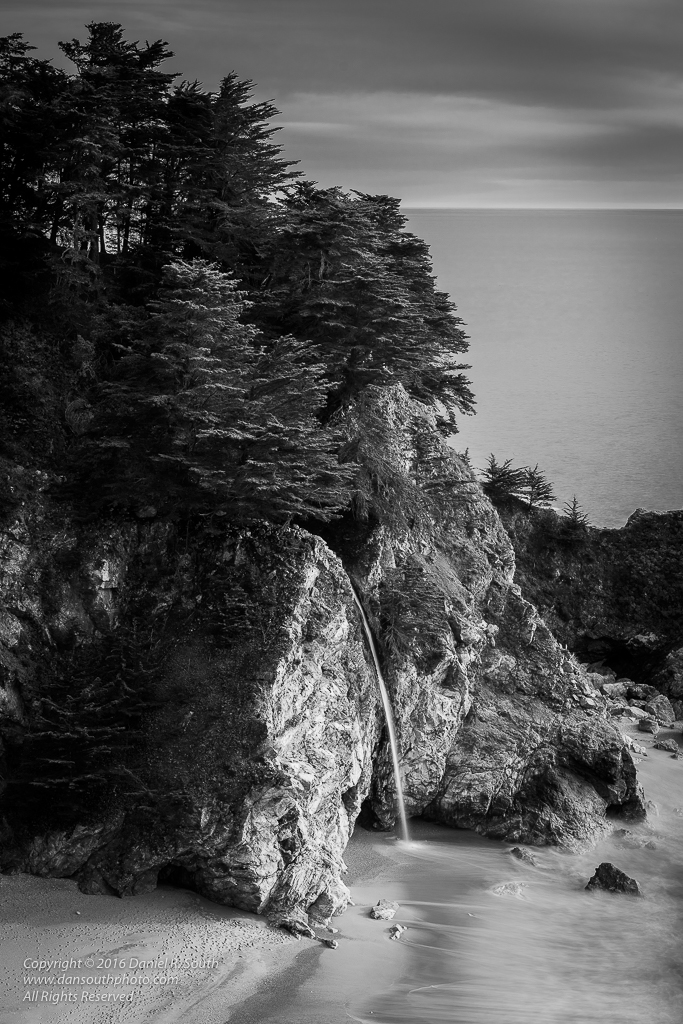 a black and white photography of mcway waterfalls in big sur california
