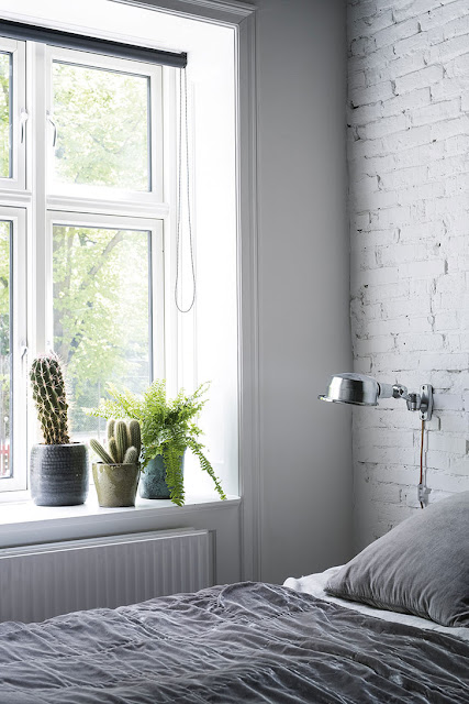 Black & White apartment in Copenhagen with interesting metallic contrasts