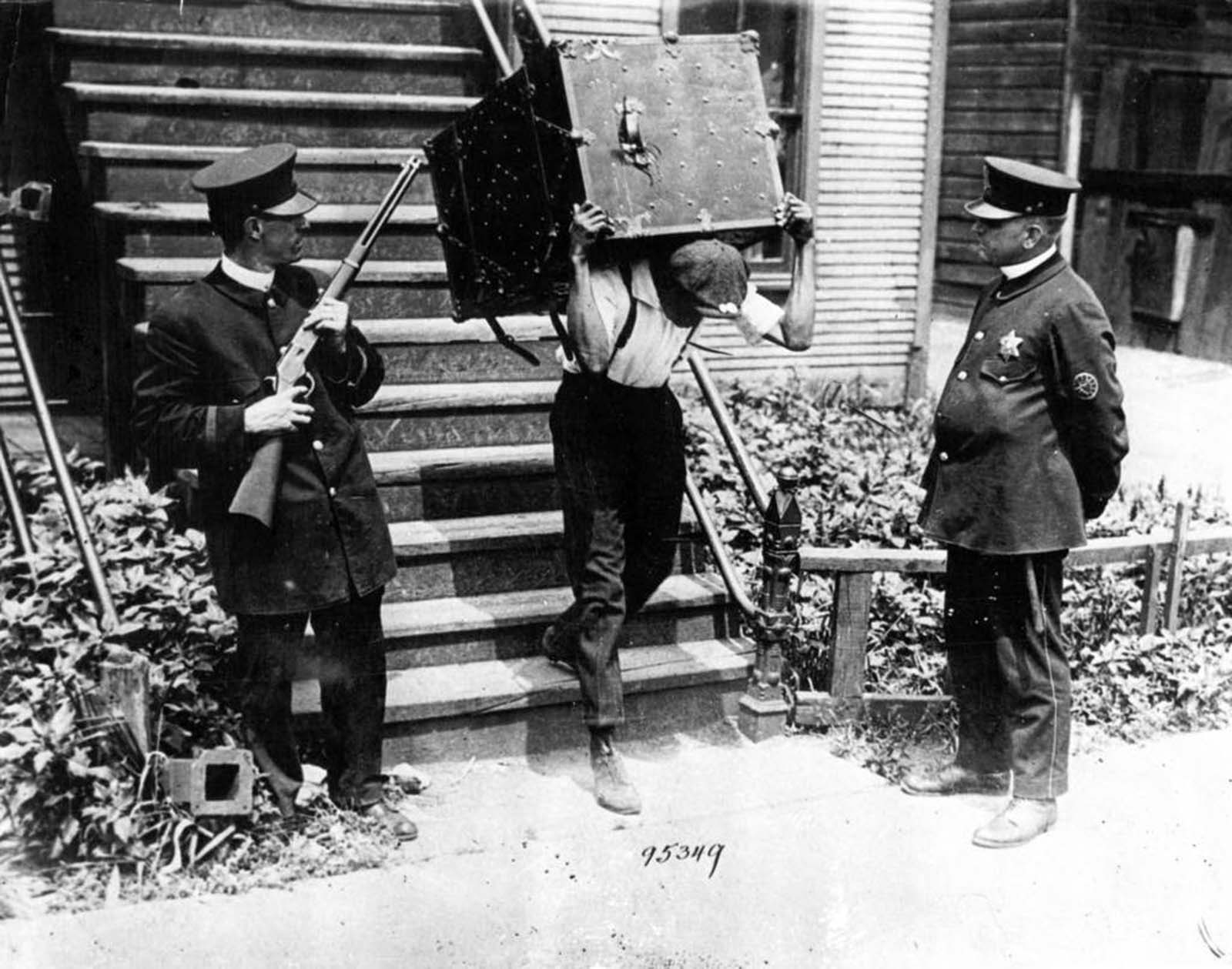 A black resident of the south side moves his belongings to a safety zone under police protection during the Chicago race riots of 1919