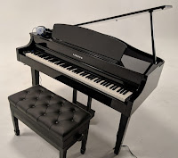 Yamaha CLP665GP digital grand piano with an optional artist bench