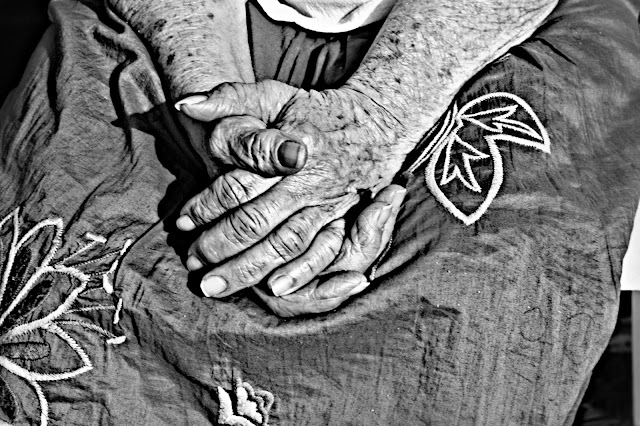 When Mother's Day Hurts - Photo of a woman's hands folded in her lap by RosevineCottageGirls.com