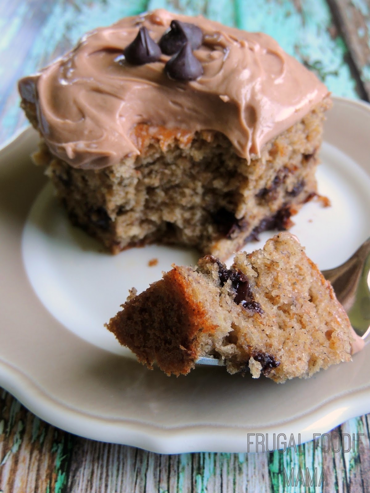 Banana Chocolate Chip Cake-a moist, thick banana cake studded with chocolate chips and then topped with a creamy and decadent Nutella cream cheese frosting