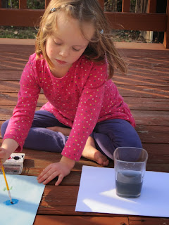 Mabel painting on the deck