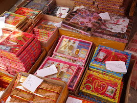 boxes contain a variety of paper replicas including smartphones and jewelry
