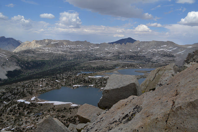 dark mountain behind a ridge like and a lot of lakes