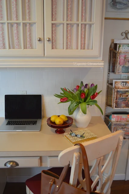 Kitchen Desk with fabric covered glass cabinets above it