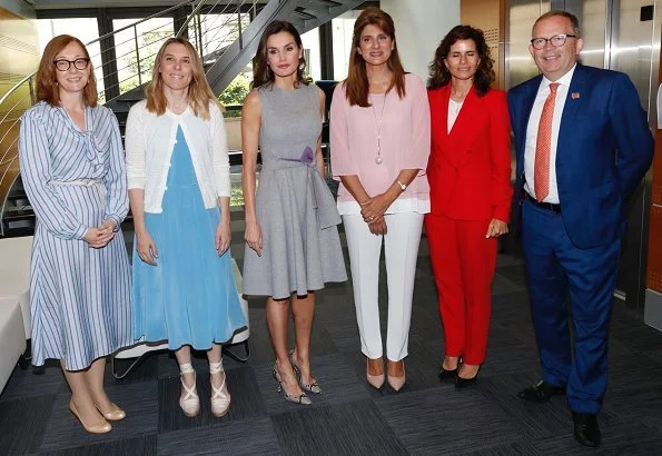 Queen Letizia wore Carolina Herrera dress and coat from-Fall 2016 2016 collection. Magrit snake printed pumps and Magrit snake printed clutch