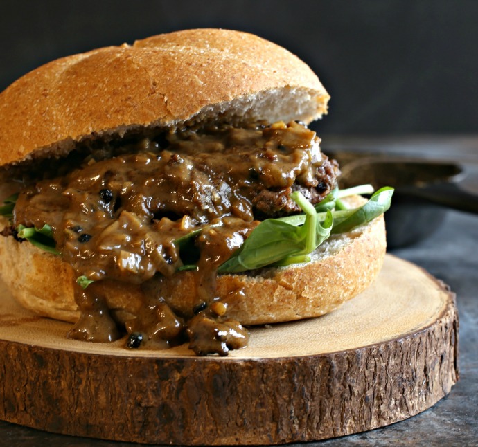 Recipe for hamburgers cooked with a creamy au poivre peppercorn sauce.