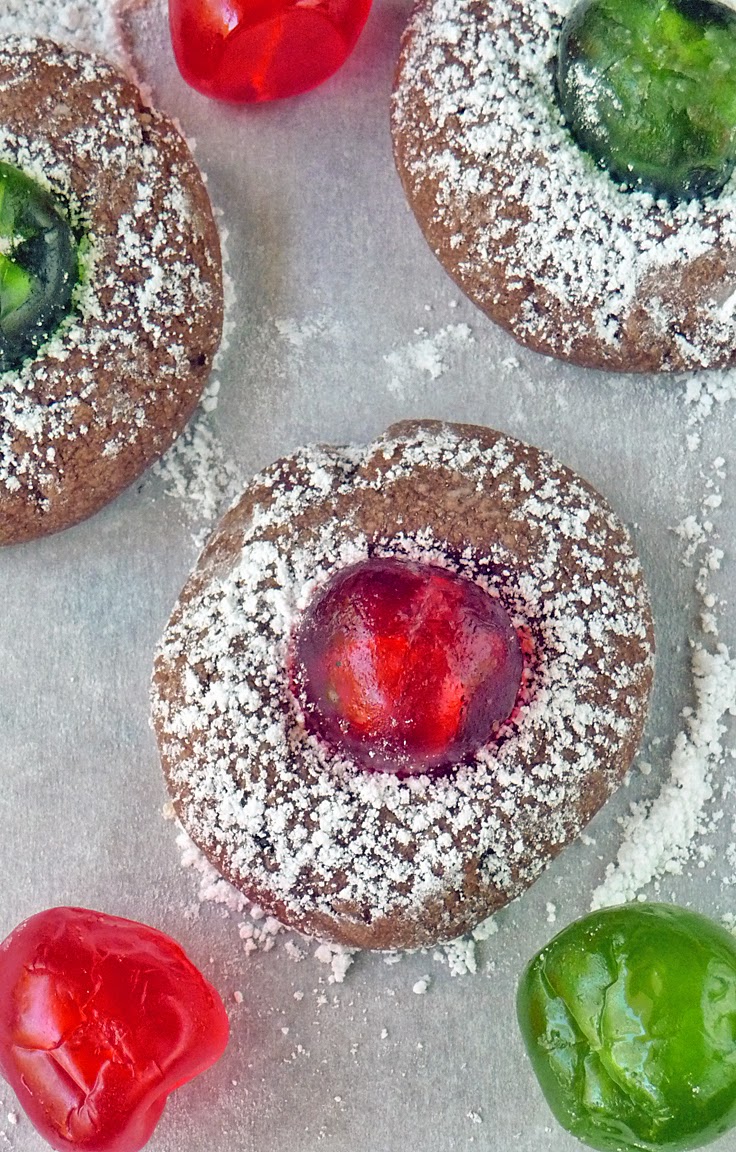 Chocolate Cherry Cookies | by Life Tastes Good are a wonderful addition to your Christmas cookie tray. A delicately rich chocolate cookie studded with a sweet candied cherry is as delicious as it is beautiful. These festive cookies are easy to make too!