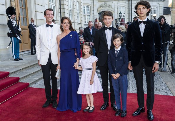 Crown Princess Mary wore a gown by Jesper Høvring. Princess Marie wore a gown by Rikke Gudnitz. Princess Isabella, Princess Alexandra
