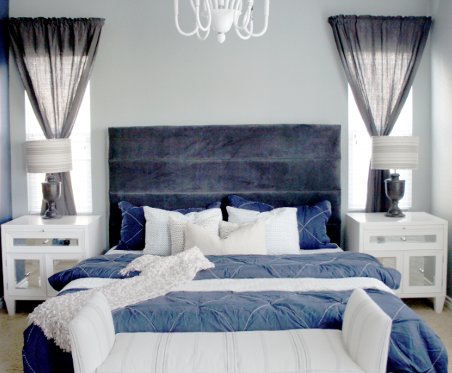 gives this bedroom a tranquil and elegant feel while the blue bedding ...