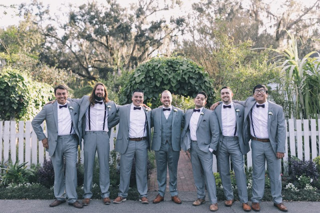 groomsmen in plum and suspenders