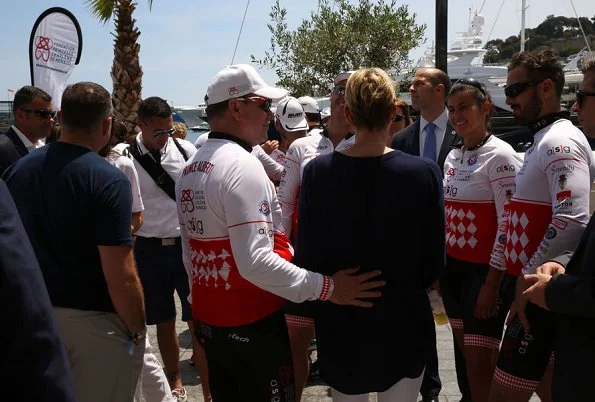 Prince Albert and Princess Charlene attended Riviera Water Bike Challenge at Monaco Yacht Club. Princess Charlene a injury in her wrist.