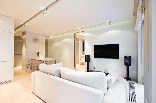 Sofas at Home Lightened by Track Lamp on Ceiling