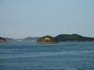 Small island in Seto inland sea taken from a ferry travelling from Naoshima (Miyanoura)to Uno