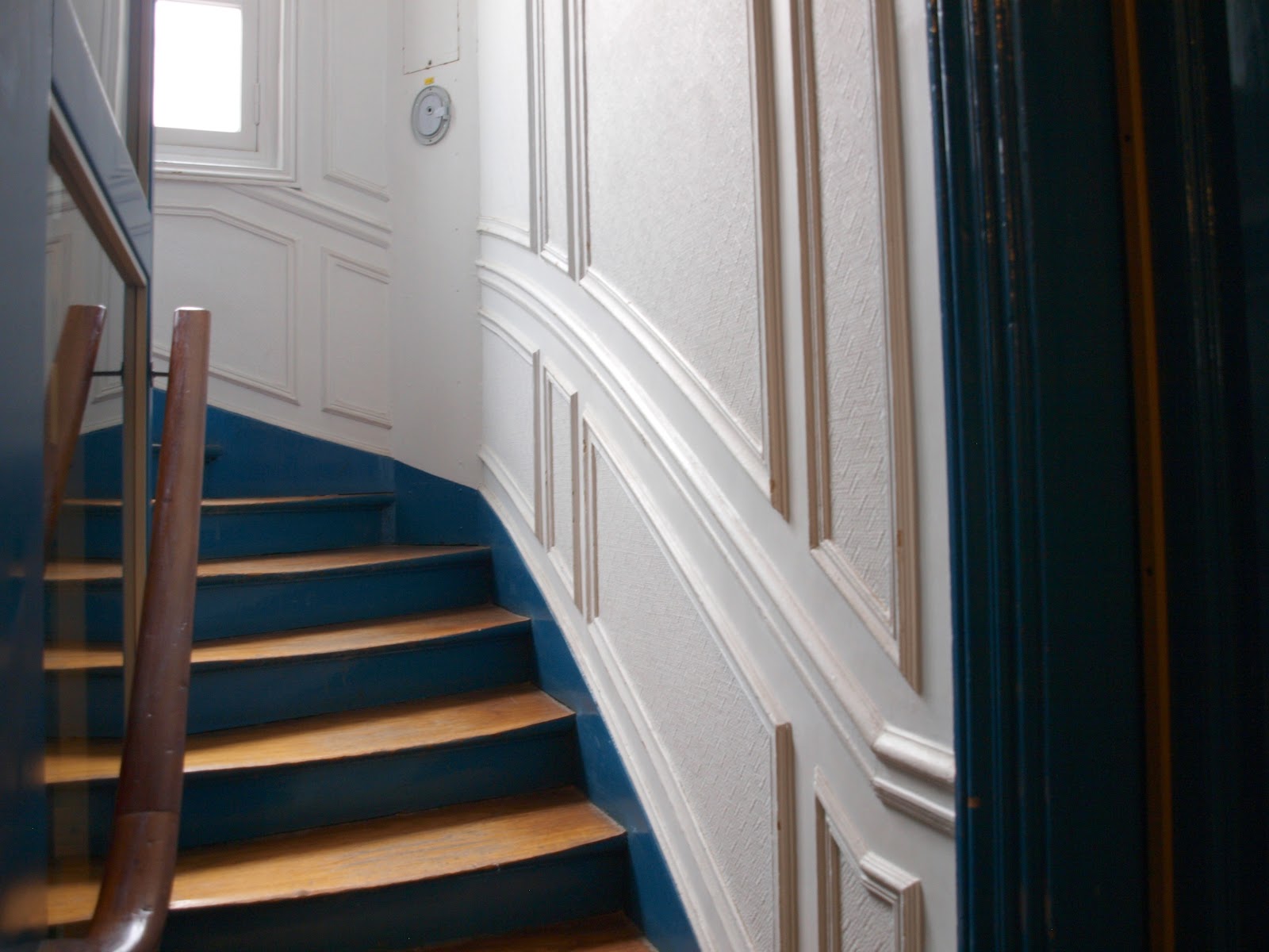 Gorgeous curved #stairway with raised panel moldings in #Parisapartment by Hello Lovely Studio