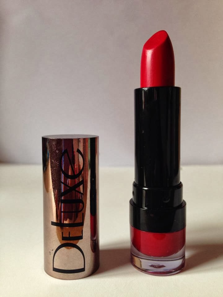  tube of bright red collection 2000 lipstick inside a black case