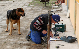 Bekir welding while Rambo watches on Bekir welding while Rambo watches on