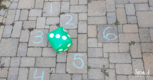 With dice and chalk, you've got an easy way to practice counting and addition outside in the summer. You could use the same concept and bring it into the house or classroom in the winter.