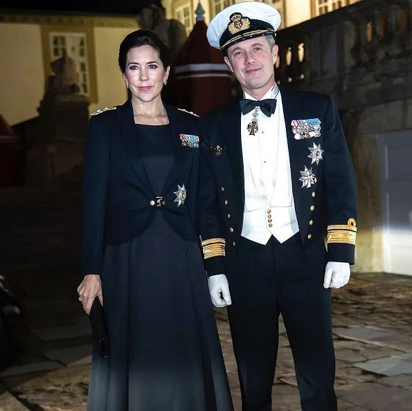 Crown Princess Mary is wearing a tailored jacket honoring the Navy officers. Crown Prince Frederik attended the dinner