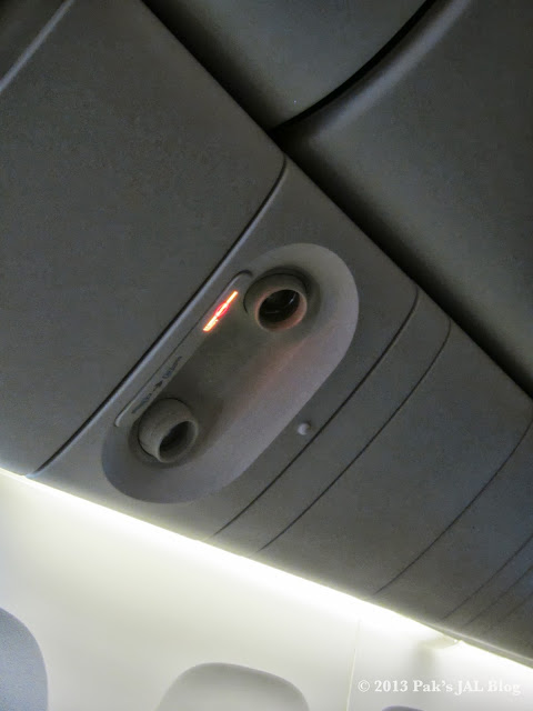 The traditional reading lights above the seat