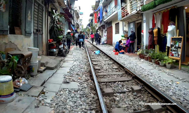 Train passes through the Train Street, Hanoi, Vietnam