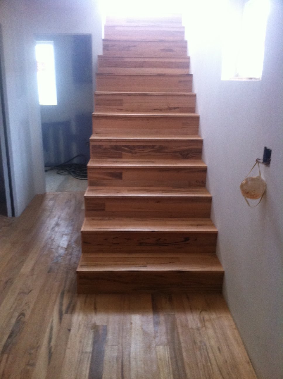 Seattle Passive Solar Home Remodel Wood flooring installed on stair treads