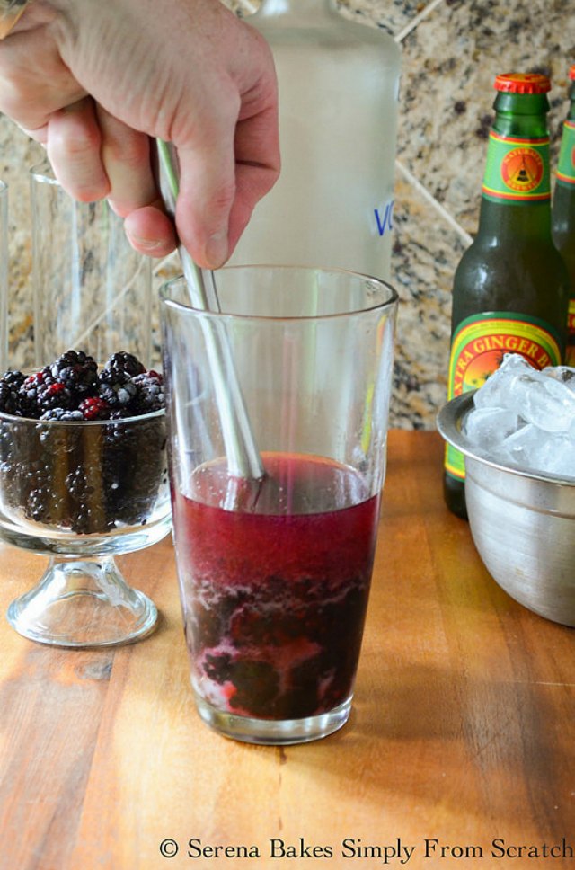 Blackberry Moscow Mules muddle blackberries with sugar from Serena Bakes Simply From Scratch.