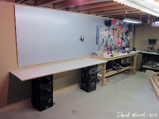 arts and crafts area with work area in basement
