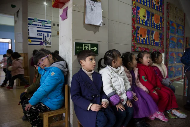 Alo-baidi Yousif (M), 4, an Iraqi child born in China, sits with other children in a kindergarten in Yiwu, Zhejiang Province, China 11 January 2017. In 2016, Yiwu issued 9,675 people with temporary residence permits, nearly half of them from war-torn countries including Iraq, Yemen, Syria and Afghanistan. To match story CHINA-MIGRANTS/MIDEAST Thomson Reuters Foundation