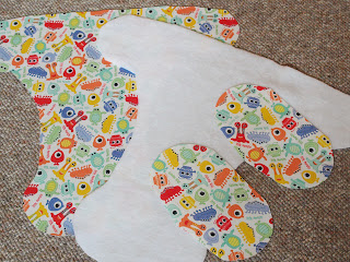 Handmade by Joanne Rich. Materials cut for cloth diaper cover with Velcro tab pockets.