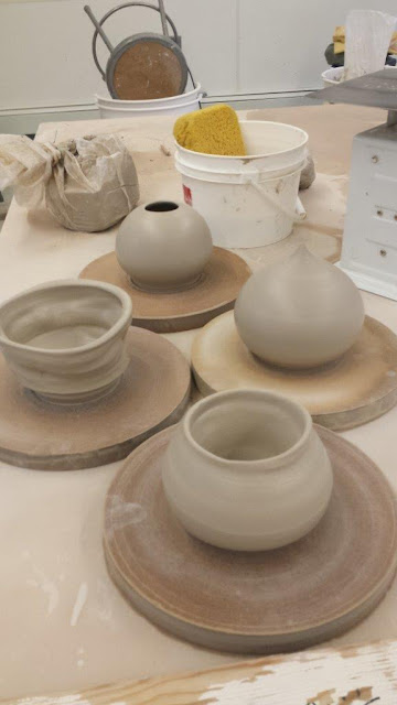 Ceramic pottery wheelthrown and altered pots in progress.