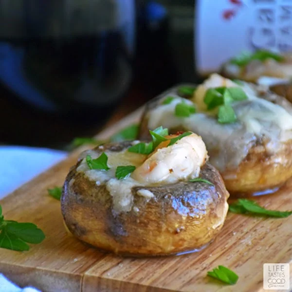 Shrimp Stuffed Mushrooms | by Life Tastes Good is shrimp sauteed in garlic butter carefully stuffed inside mushroom caps and smothered in melted mozzarella cheese is a deliciously elegant appetizer for any occasion. #SundaySupper