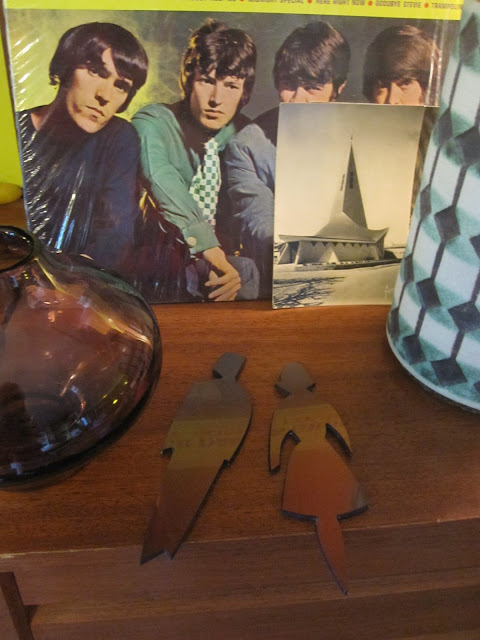 a vintage Jasba west germany vase , The Spencer Davis Group "gimme some lovin" lp , a glass vase Riihimaen Lasi Oy by Aimo Okkolin , toilet symbols , post cards  ( french church with modern architecture)  yard sales garage sales 1950 1960 1970 50s 60s 70s mid century 