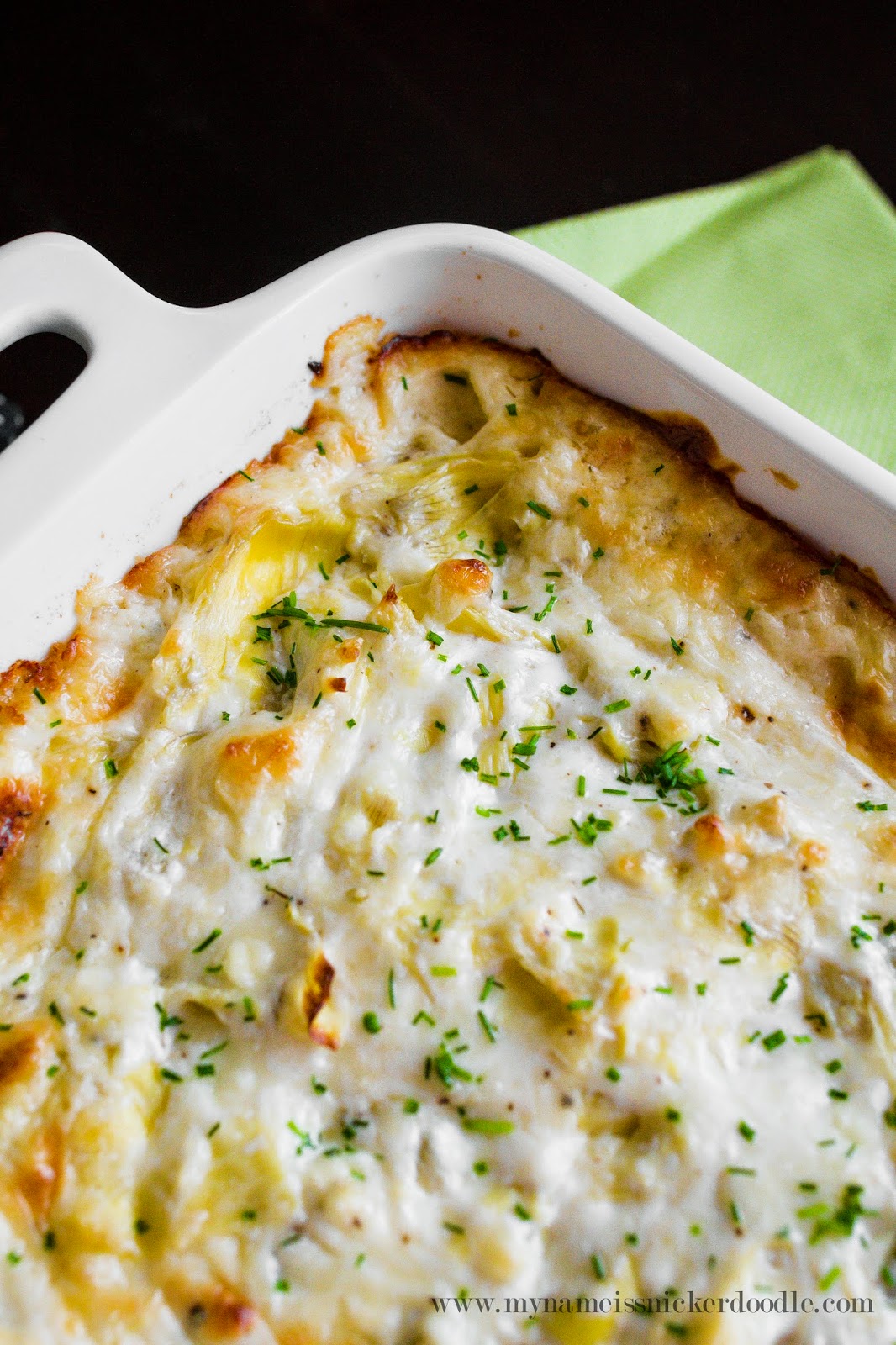 The BEST cheesy artichoke dip EVER!!!  It's made with three cheese and served hot.  |  mynameissnickerdoodle.com