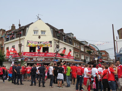 Albanian and Swiss fans mingle.