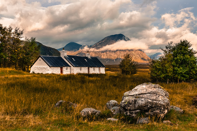 Photo of The cottage with Buachaille Etive Mor sun lit in the background